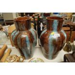 A pair of studio pottery vases decorated with runn