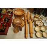 A collection of various wooden bowls and rolling p