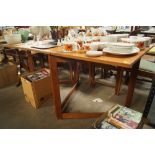 A teak drop leaf table