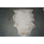 An approx. 3'1" x 2'5" Sheep skin rug