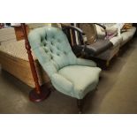 A button back upholstered nursing chair