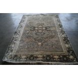 An approx. 9'4" x 5'11" floral patterned rug