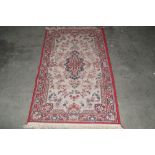 An approx. 5' x 2'8" red patterned rug