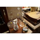 A glass ships decanter, two other decanters a pape