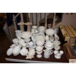 A large quantity of various white and cream glazed