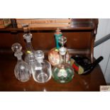 A quantity of various decanters and stoppers to in