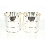 A pair of plated barrel shaped wine coolers, 21.5c