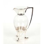 A silver plated and glass claret jug