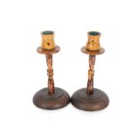 A pair of Art Deco wooden and Bakelite dwarf candl
