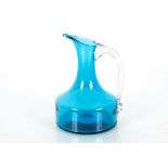 A Whitefirars blue glass jug with clear handle, pa