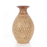 A terracotta baluster vase with thumb press decora