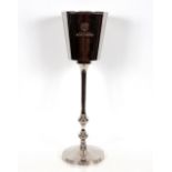 A plated Bollinger style Champagne cooler on stand