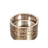 A silver and yellow metal inlaid snap bangle appro