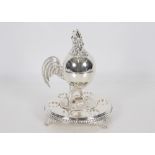 A silver plated egg cruet stand