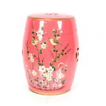 A pink porcelain barrel shaped garden seat with bi