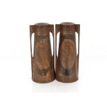 A pair of Art Nouveau twin handled tin urns, 34cm