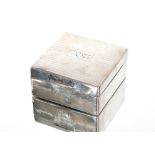 A small silver cedar lined cigarette box bearing i
