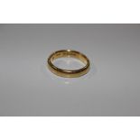 A 22ct gold wedding band, total weight 6.5gms