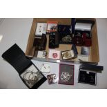 A box containing various boxed cuff-links, ear-rin