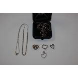 A Sterling silver and diamond set heart pendant and