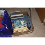 A box of various miscellaneous books