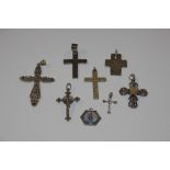 A collection of Sterling silver crosses including