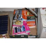 A box containing various Ordnance Survey maps