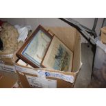 A box containing various pictures and prints to in