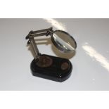 An adjustable magnifying glass on stand