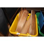 A box containing various vintage shoe horns