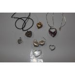 A collection of Sterling silver heart pendants and