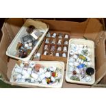 A quantity of various porcelain thimbles