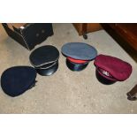 A box of various military style hats