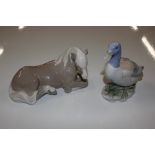 A Lladro ornament in the form of a horse and a fig