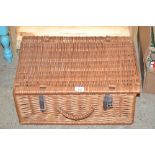 A wicker basket and contents of various lace and o