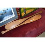 A pair of wooden canoe paddles