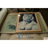 A photographic print of a tiger and a coloured pri