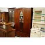 A Edwardian inlaid mirror door wardrobe