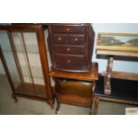 An oak magazine table and chest fitted two short,