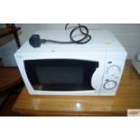 A Curry's Essentials microwave oven (sold as seen)