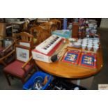 A Parker Knoll teak extending dining table with si