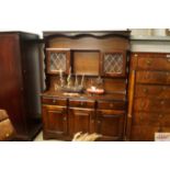 An oak and leaded glazed dresser