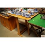 A drop leaf kitchen table