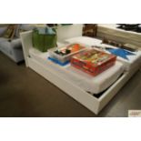 A white leather effect single bed with storage