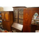 An oak and leaded glazed bureau bookcase