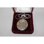 A large oval silver locket, Birmingham 1974, by Na