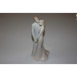 A Royal Worcester "Moments" Bride & Groom figure