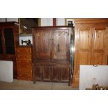 An antique oak press cupboard