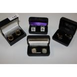 Four pairs of various cased cuff-links