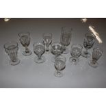 A collection of various small antique glasses